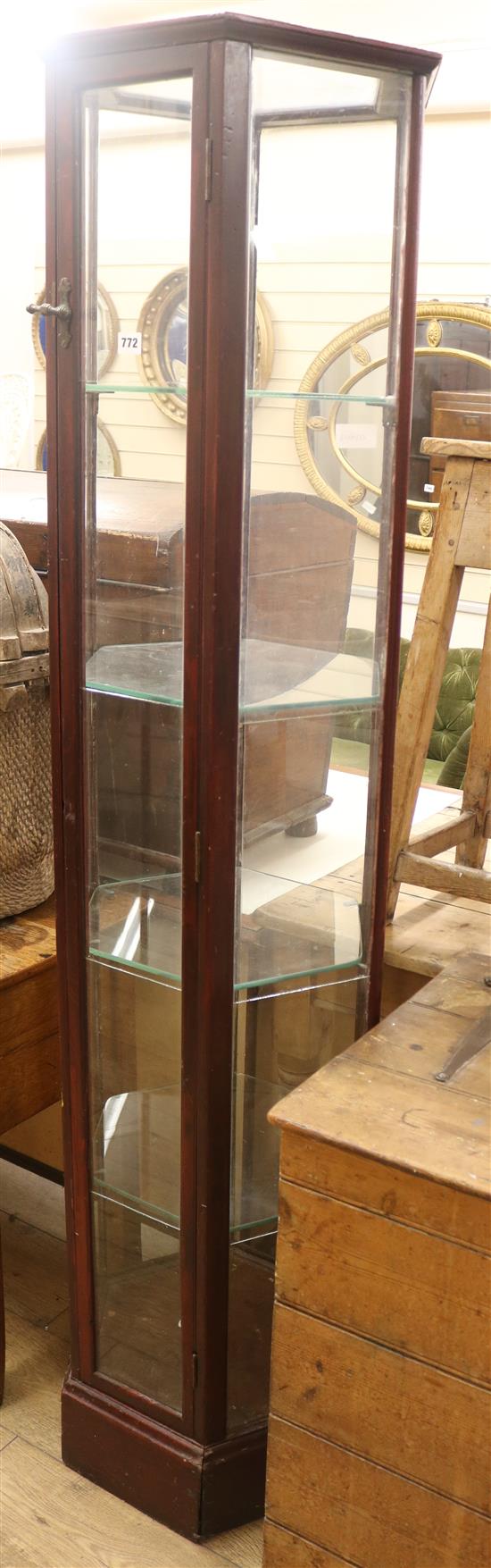 A floor standing hexagonal shop display cabinet, with plated glass shelves, H.183cm